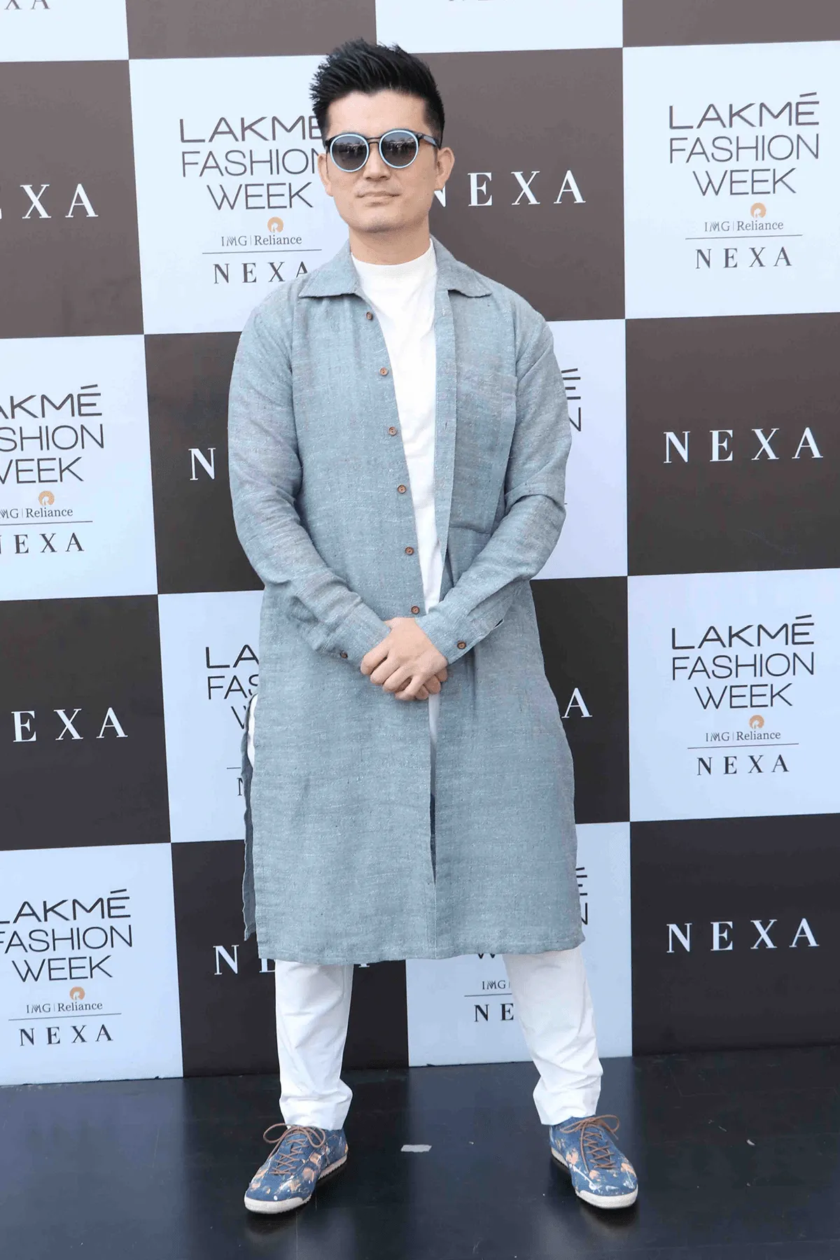 Meiyang Chang In Blue long shirt with white polo neck and white trousers