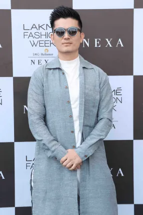 Meiyang Chang In Blue long shirt with white polo neck and white trousers